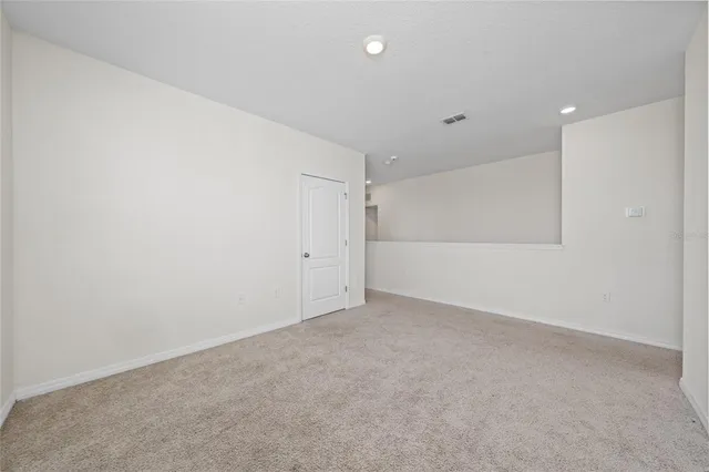 an aerial view of a house with a swimming pool