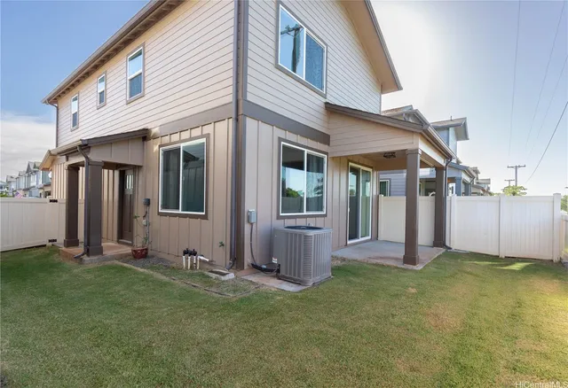 a view of a house with backyard and porch