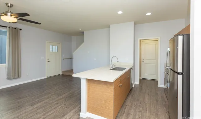 a view of a kitchen from the hallway