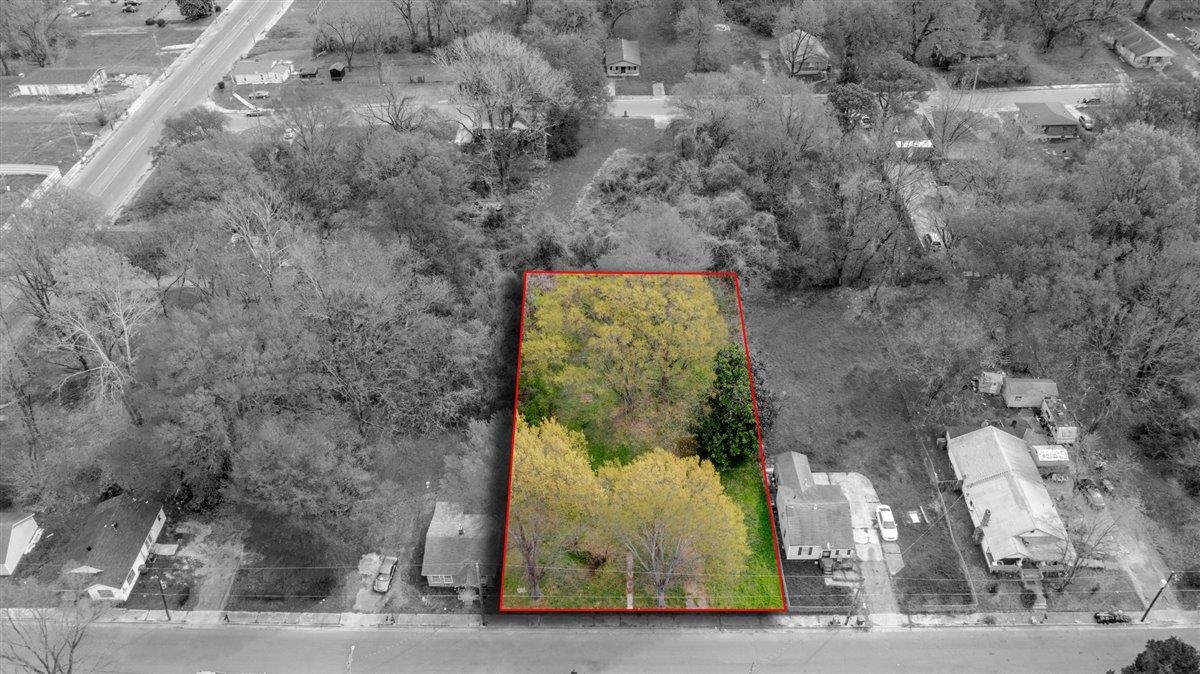 Aerial perspective of suburban area featuring property boundaries highlighted