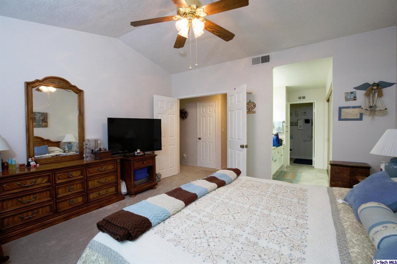 25633 Salceda Road Valencia, CA 91355 - Photo 12 of 29 a bedroom with a bed and a flat screen television