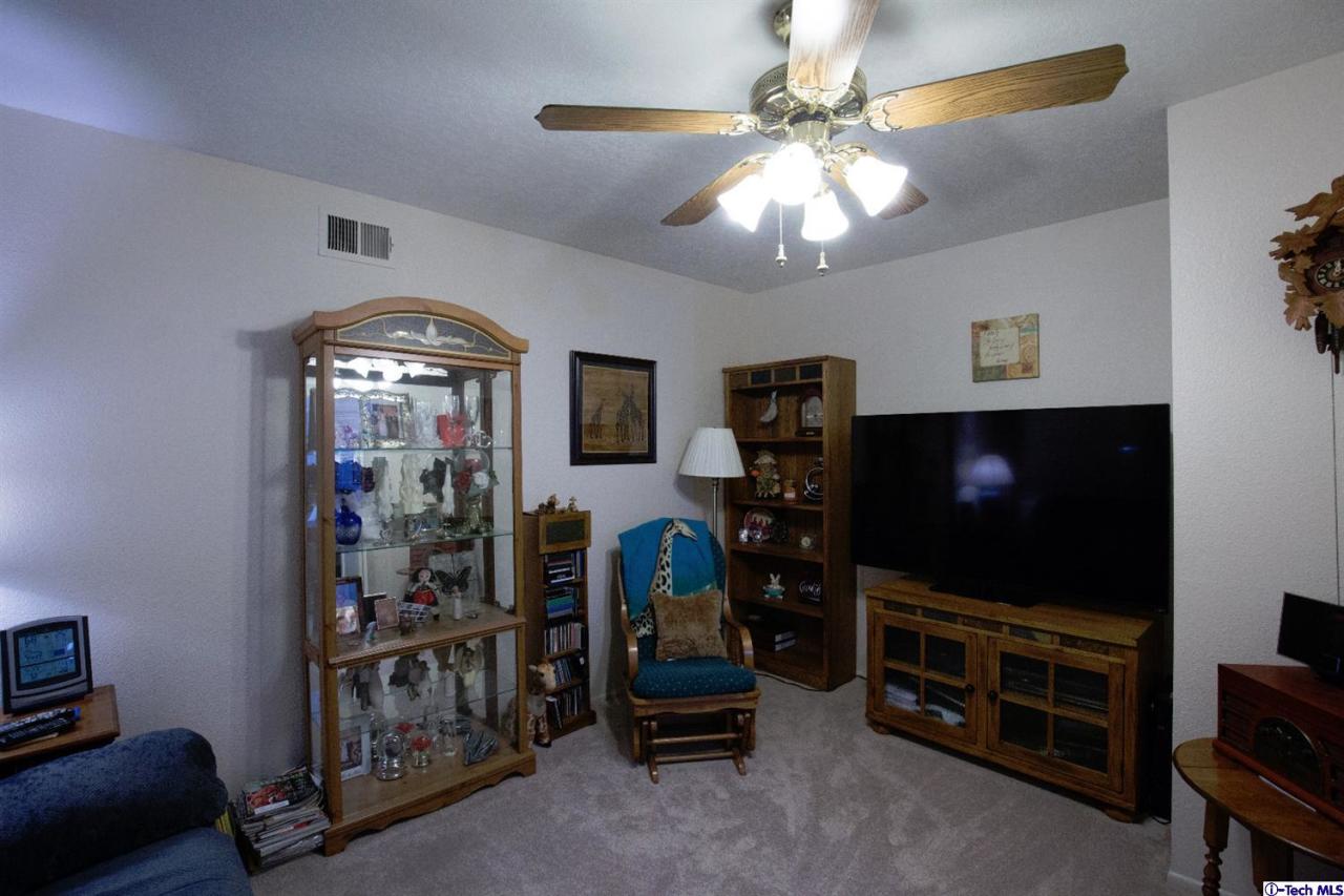 25633 Salceda Road Valencia, CA 91355 - Photo 17 of 29 a living room with furniture and a flat screen tv