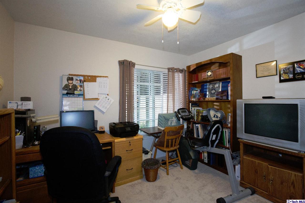 25633 Salceda Road Valencia, CA 91355 - Photo 23 of 29 a living room with furniture and a flat screen tv
