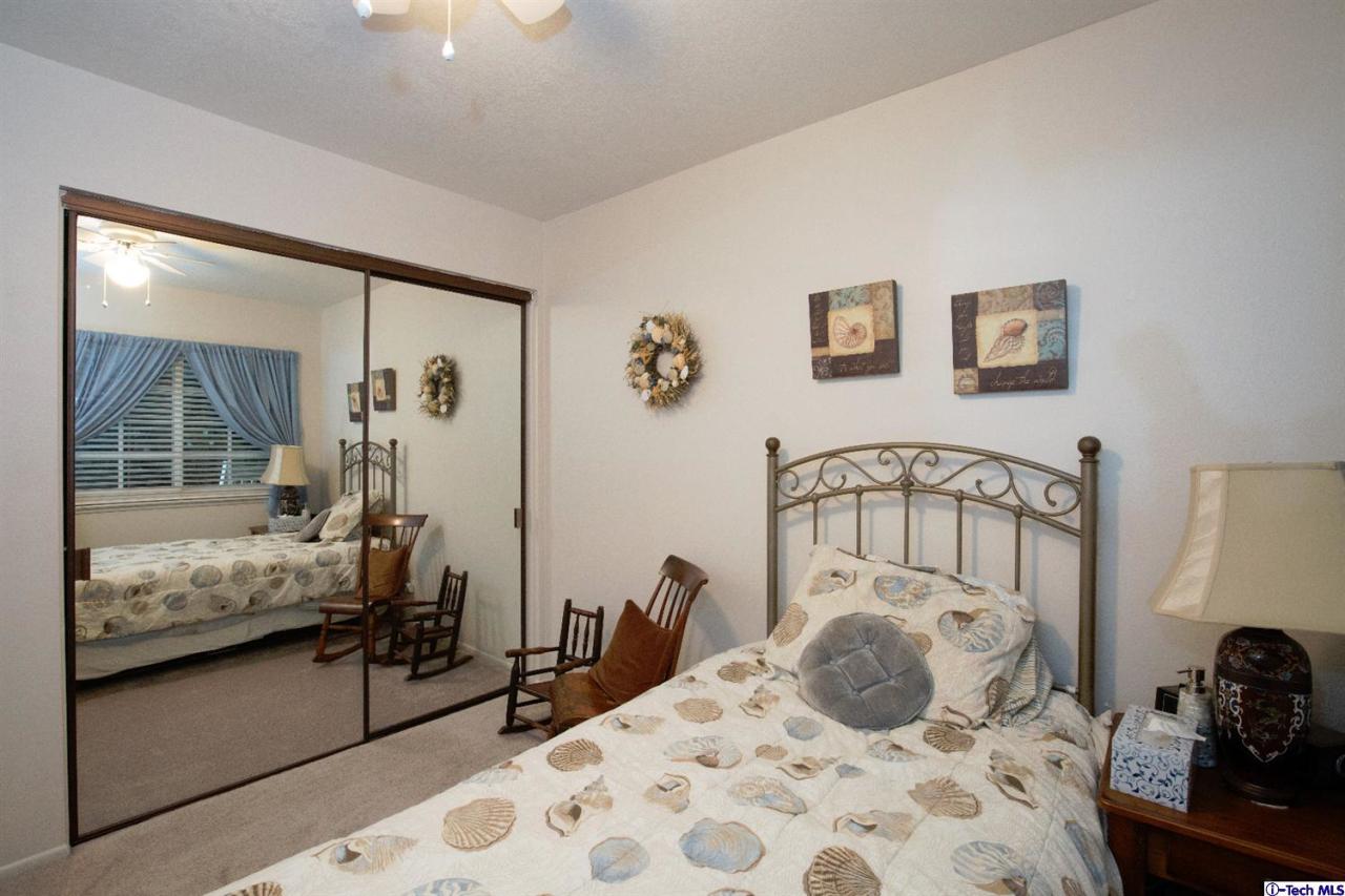 25633 Salceda Road Valencia, CA 91355 - Photo 26 of 29 a bedroom with a bed and wooden floor