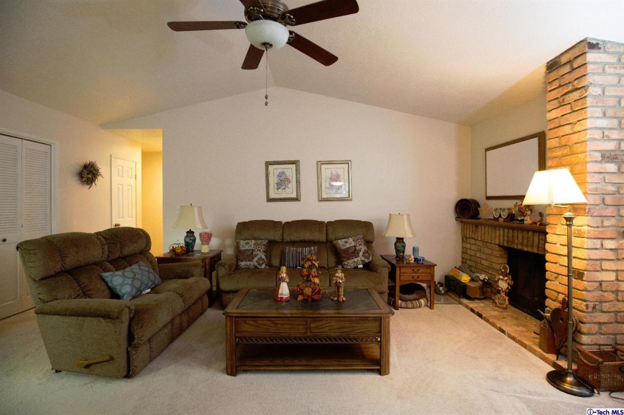 25633 Salceda Road Valencia, CA 91355 - Photo 5 of 29 a living room with furniture and a fireplace