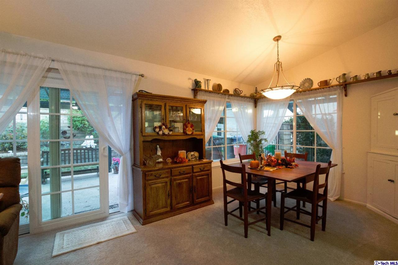 25633 Salceda Road Valencia, CA 91355 - Photo 6 of 29 a view of a roof deck with dining table and chairs