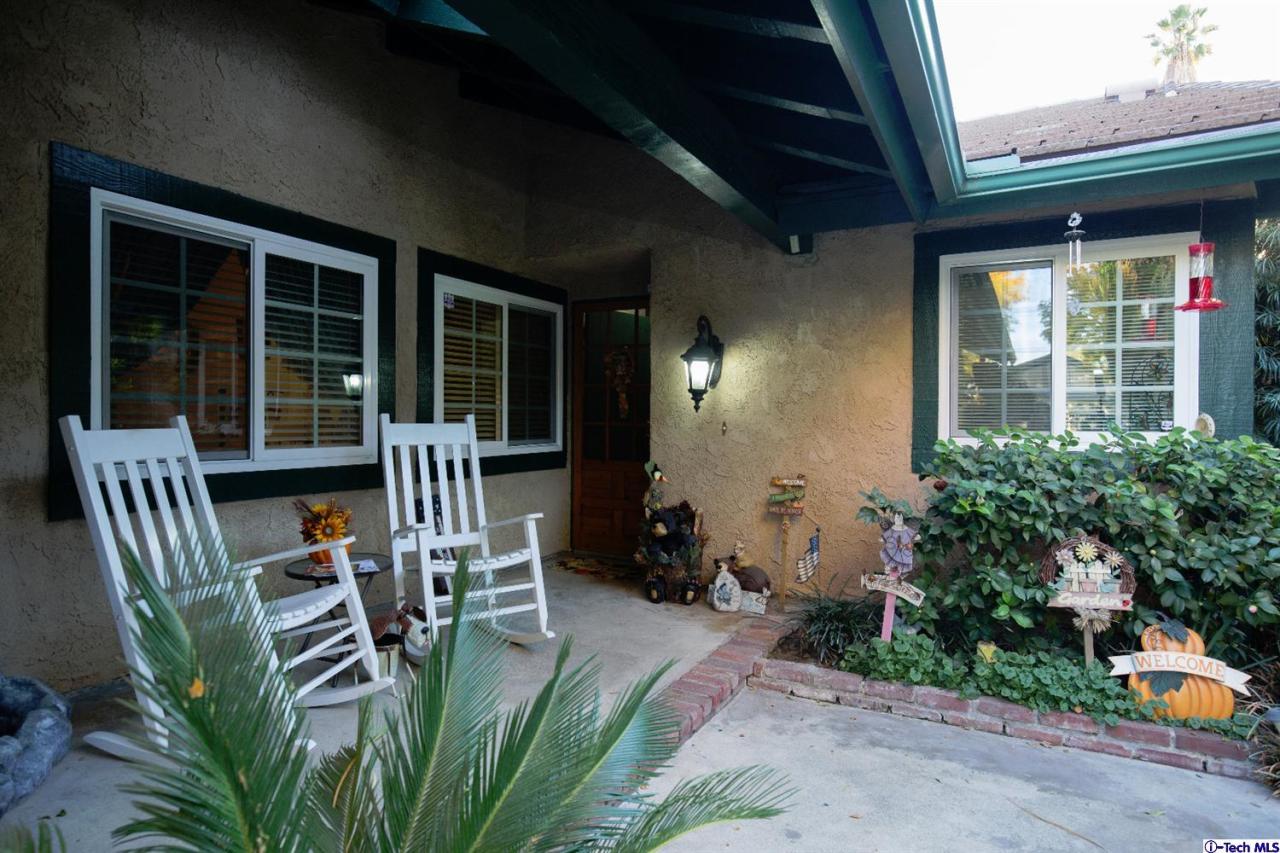 25633 Salceda Road Valencia, CA 91355 - Photo 7 of 29 a front view of a house with outdoor seating