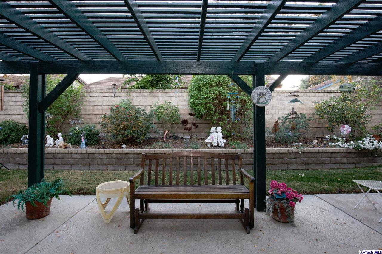 25633 Salceda Road Valencia, CA 91355 - Photo 8 of 29 a view of a porch with furniture and garden