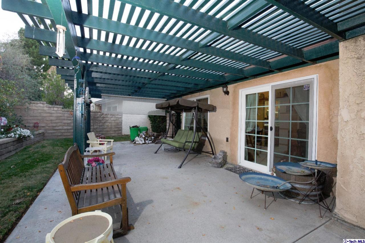 25633 Salceda Road Valencia, CA 91355 - Photo 10 of 29 a backyard of a house with barbeque oven table and chairs