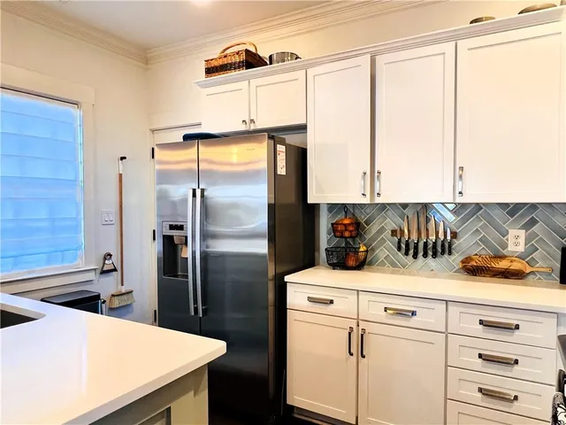a kitchen with a refrigerator and countertop