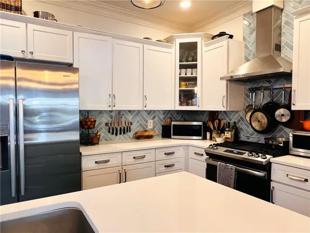 a kitchen with a stove and a refrigerator