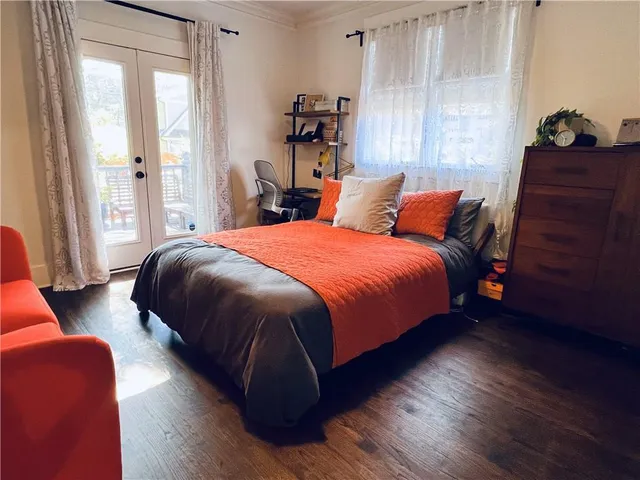 a bedroom with bed and window