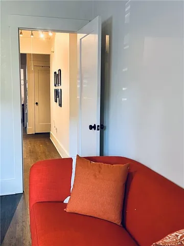 a blue bed sitting in a bedroom next to a window