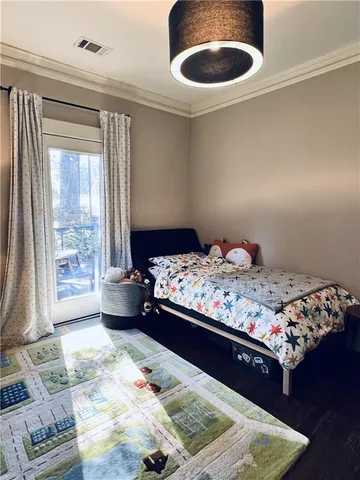 a bedroom with a bed and a window with outer view