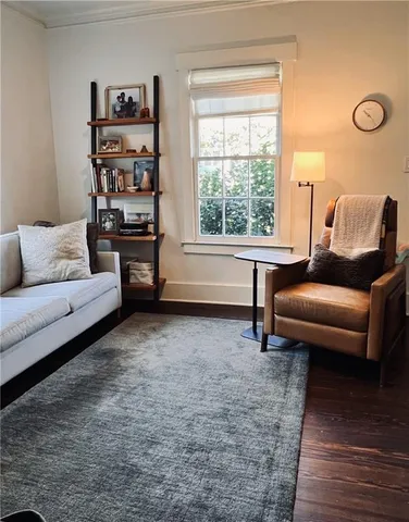 a living room with furniture and a rug