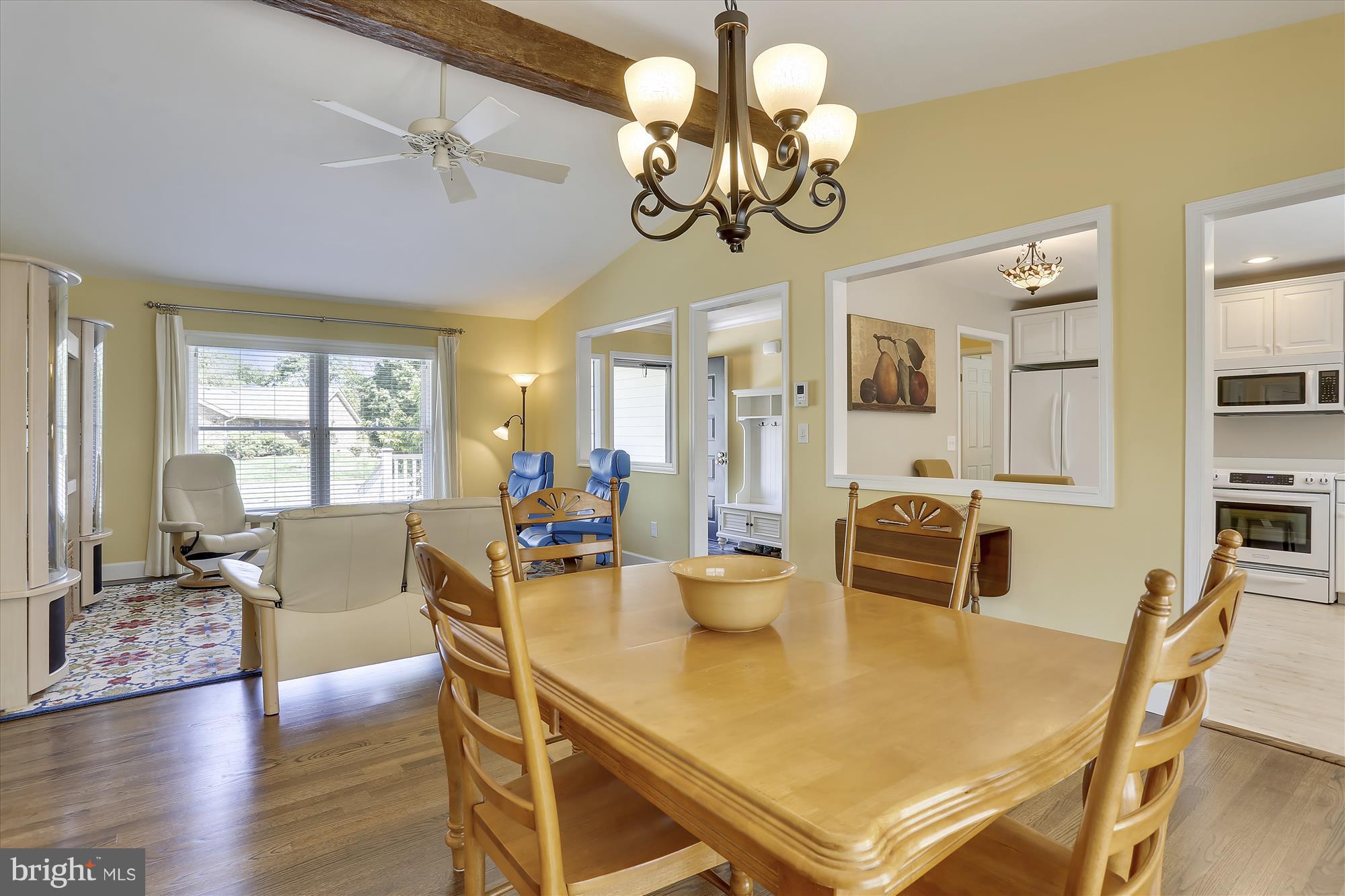 100 Birch Run Road Chestertown, MD 21620 - Photo 9 of 30 a view of a dining room with furniture a chandelier and wooden floor