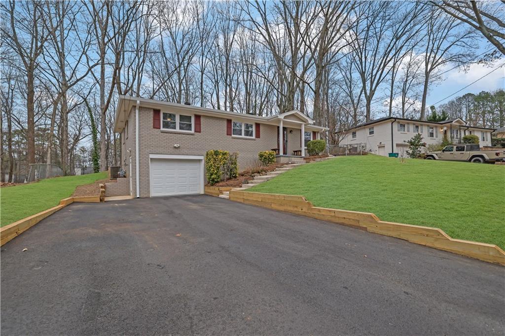 a view of a house with a yard