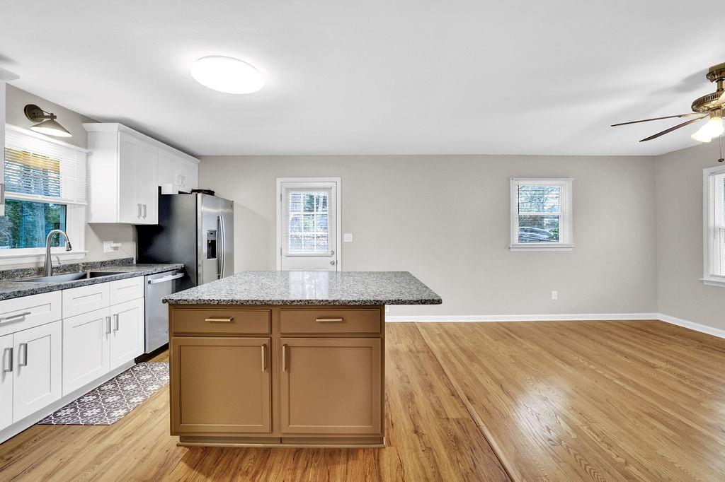 3091 Clifton Road Southeast Smyrna, GA 30080 - Photo 12 of 36 a kitchen with stainless steel appliances granite countertop a sink and a stove