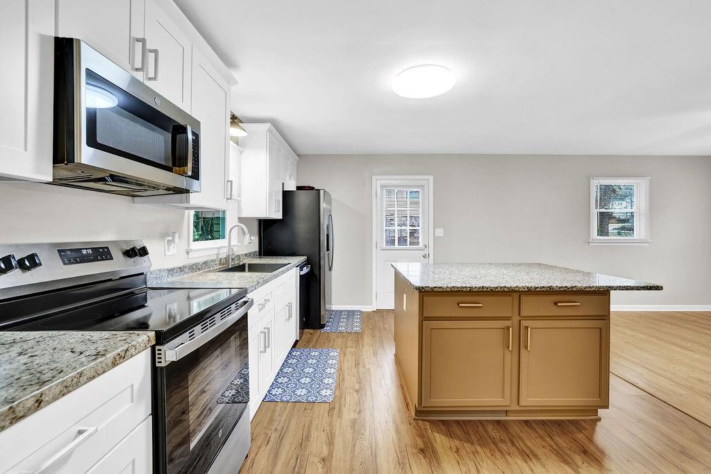 3091 Clifton Road Southeast Smyrna, GA 30080 - Photo 13 of 36 a kitchen with a sink stove and microwave