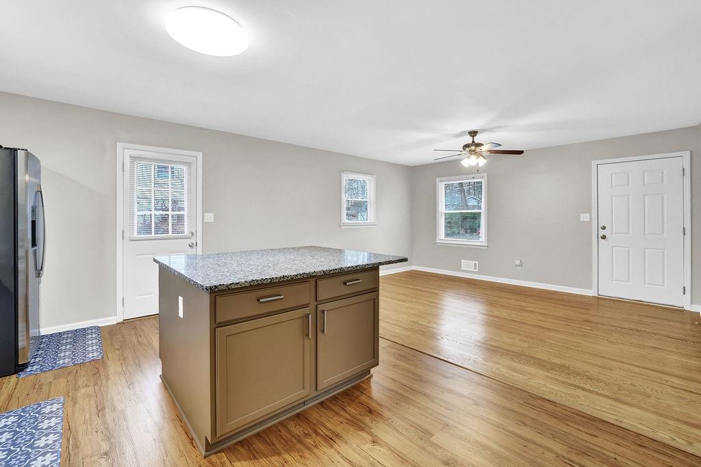 3091 Clifton Road Southeast Smyrna, GA 30080 - Photo 14 of 36 a view of an empty room with window and wooden floor