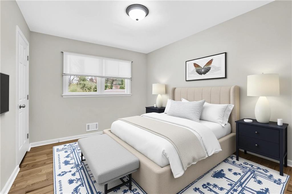 3091 Clifton Road Southeast Smyrna, GA 30080 - Photo 17 of 36 a bedroom with a bed and a lamp on dresser