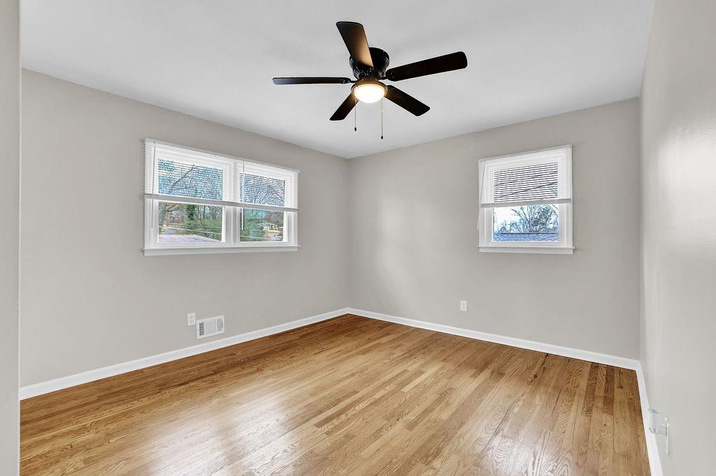 3091 Clifton Road Southeast Smyrna, GA 30080 - Photo 19 of 36 a view of empty room with wooden floor and fan