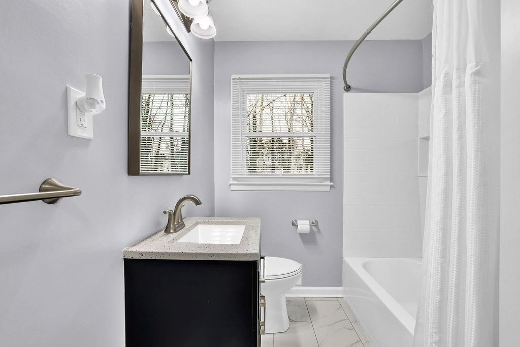 3091 Clifton Road Southeast Smyrna, GA 30080 - Photo 20 of 36 a bathroom with a sink and a bathtub