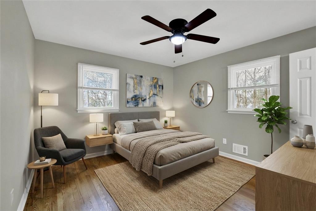 3091 Clifton Road Southeast Smyrna, GA 30080 - Photo 22 of 36 a bedroom with a bed and a chandelier