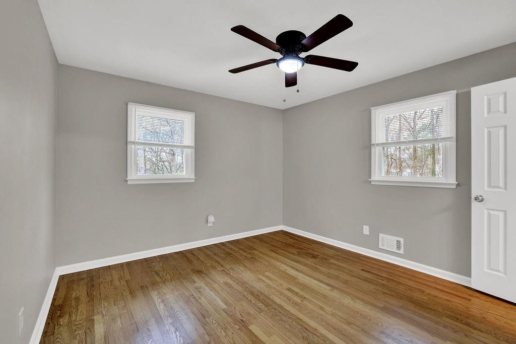 3091 Clifton Road Southeast Smyrna, GA 30080 - Photo 23 of 36 a view of a big room with wooden floor and windows