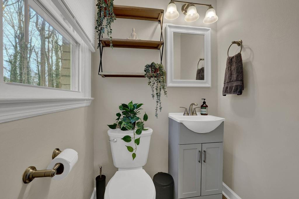 3091 Clifton Road Southeast Smyrna, GA 30080 - Photo 28 of 36 a bathroom with a sink toilet and mirror