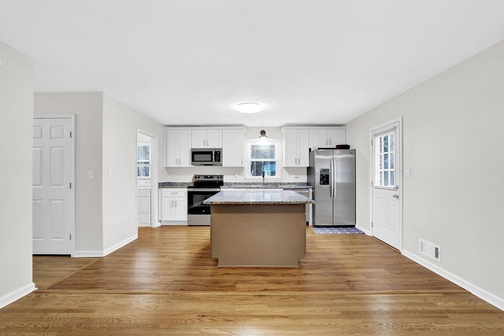 3091 Clifton Road Southeast Smyrna, GA 30080 - Photo 5 of 36 a view of kitchen with stainless steel appliances granite countertop a refrigerator and a stove top oven