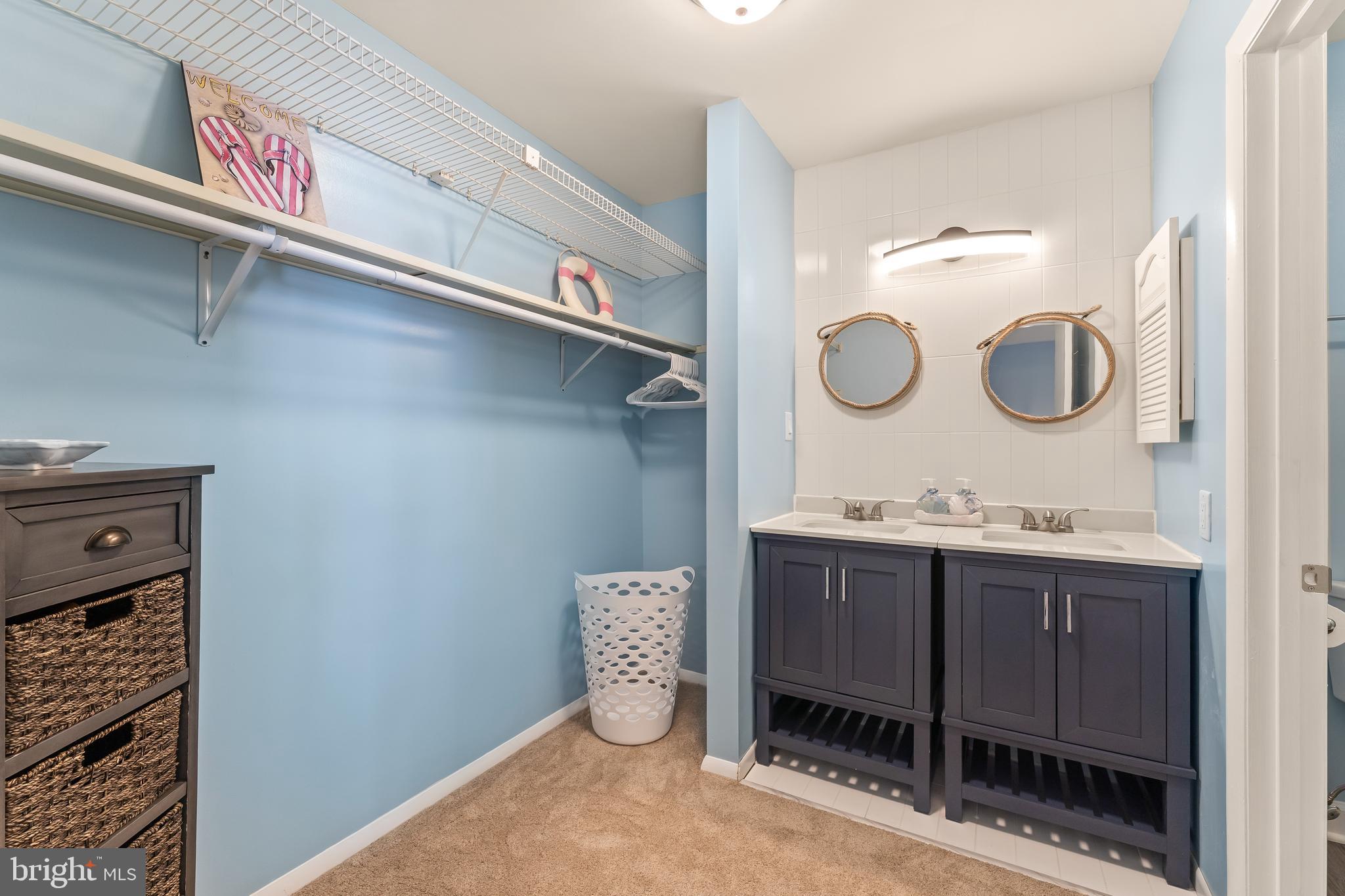 715 Washington Colonial Beach, Unit 15 Colonial Beach, VA 22443 - Photo 22 of 42 a bathroom with a sink and a mirror