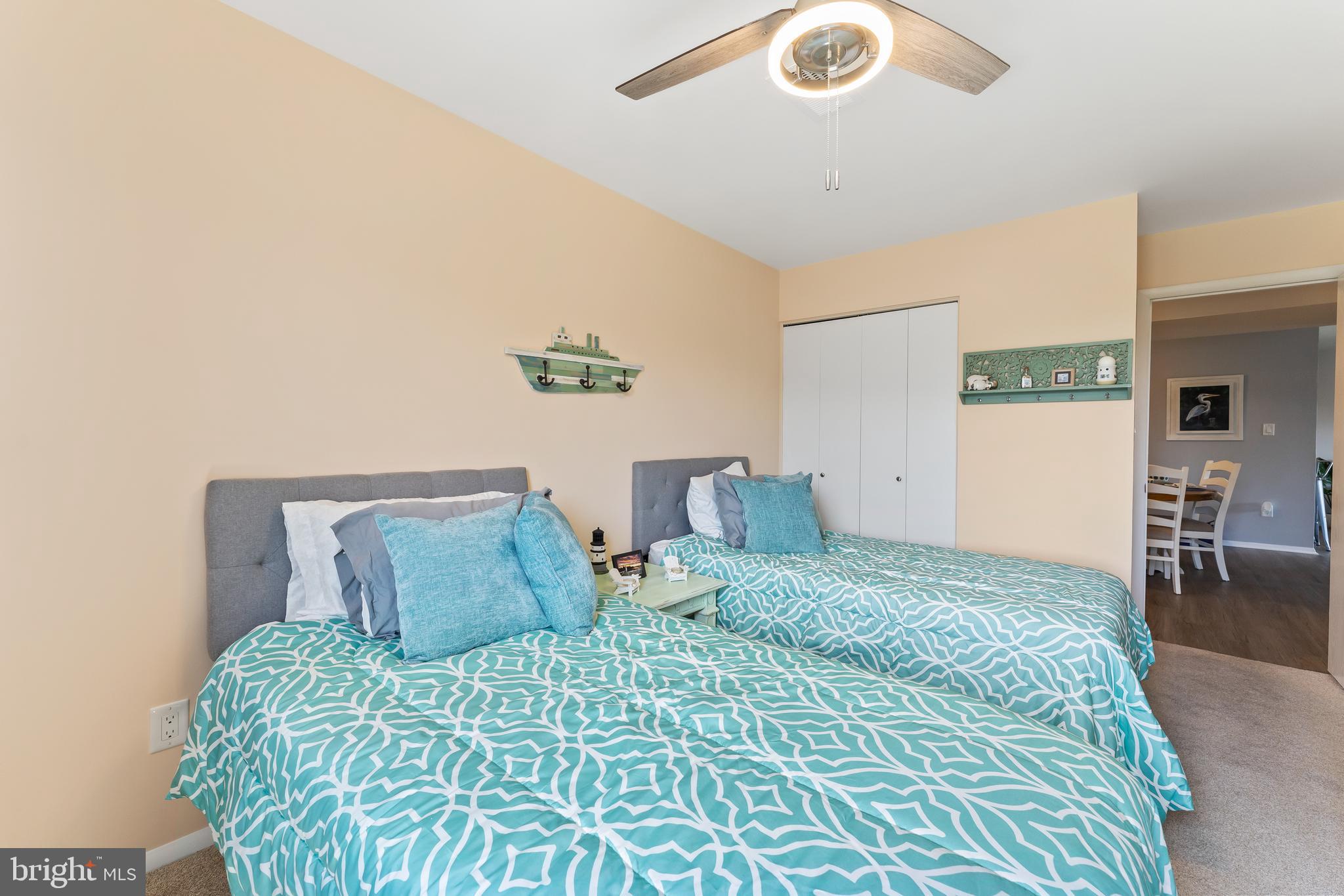 715 Washington Colonial Beach, Unit 15 Colonial Beach, VA 22443 - Photo 27 of 42 a bedroom with a bed and a cabinets