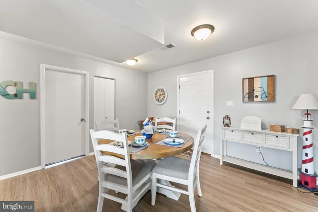a dining room with furniture and a window