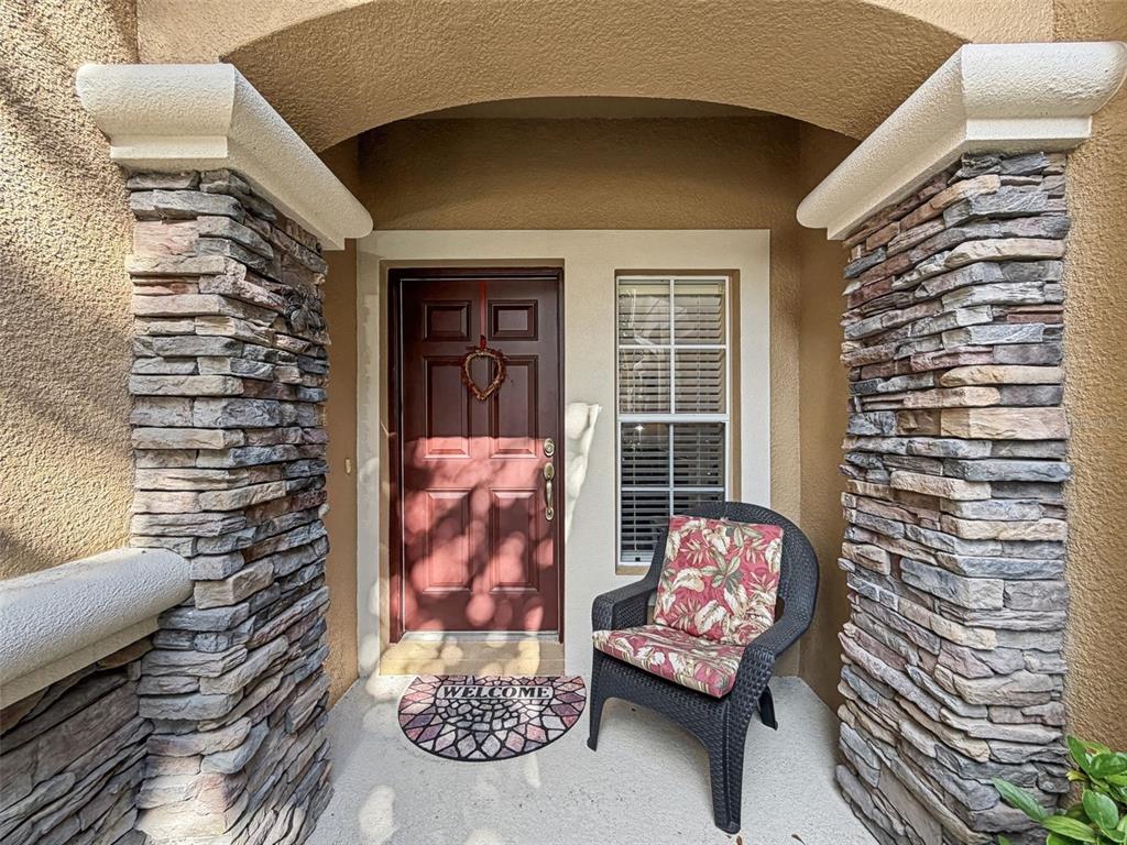 11807 Castine Street New Port Richey, FL 34654 - Photo 2 of 40 a front view of a house with outdoor seating