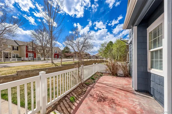 a view of a pathway of a house with a yard