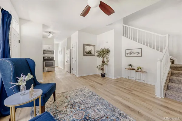 a bedroom with furniture and a rug