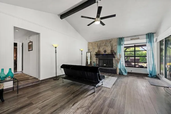 a living room with furniture and a fireplace