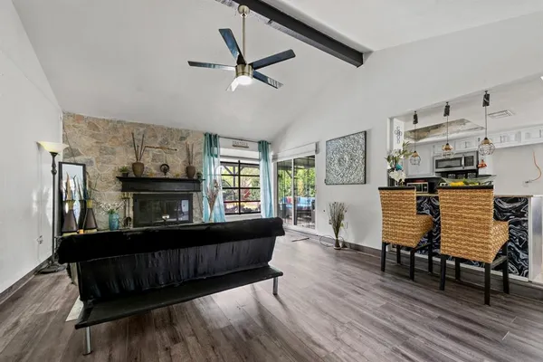 a bedroom with furniture and wooden floor
