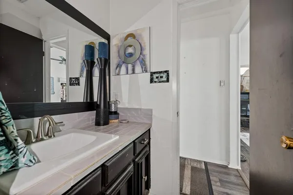 a bathroom with a sink and a mirror