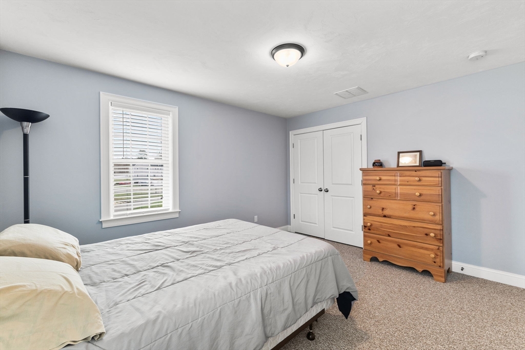 12 Stony Point Road Middleboro, MA 02346 - Photo 23 of 42 a bedroom with a bed and furniture
