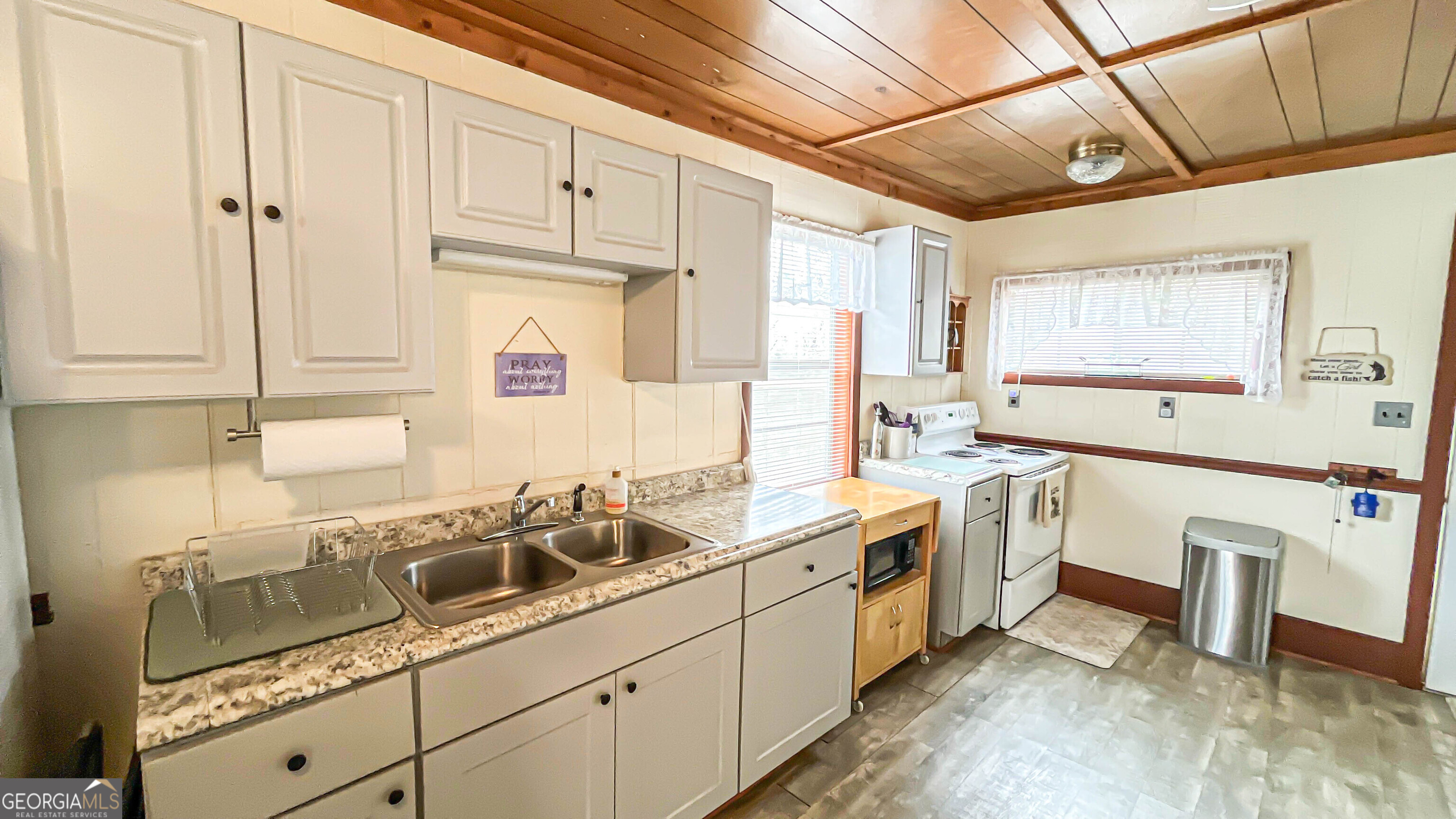 242 Katy Lake Road Jackson, GA 30233 - Photo 21 of 113 a kitchen with a sink cabinets and window