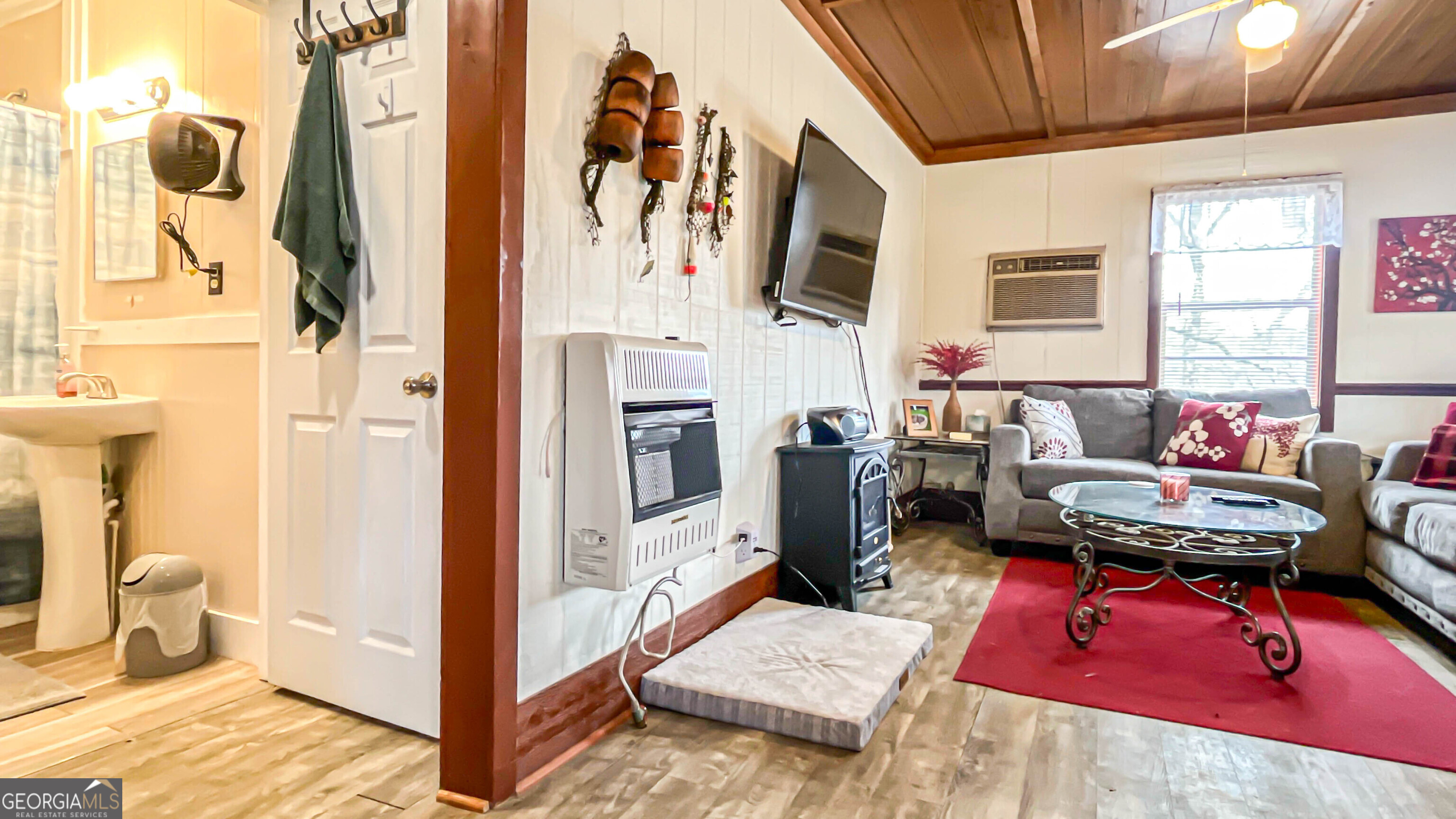 242 Katy Lake Road Jackson, GA 30233 - Photo 28 of 113 a living room with furniture fireplace and a window