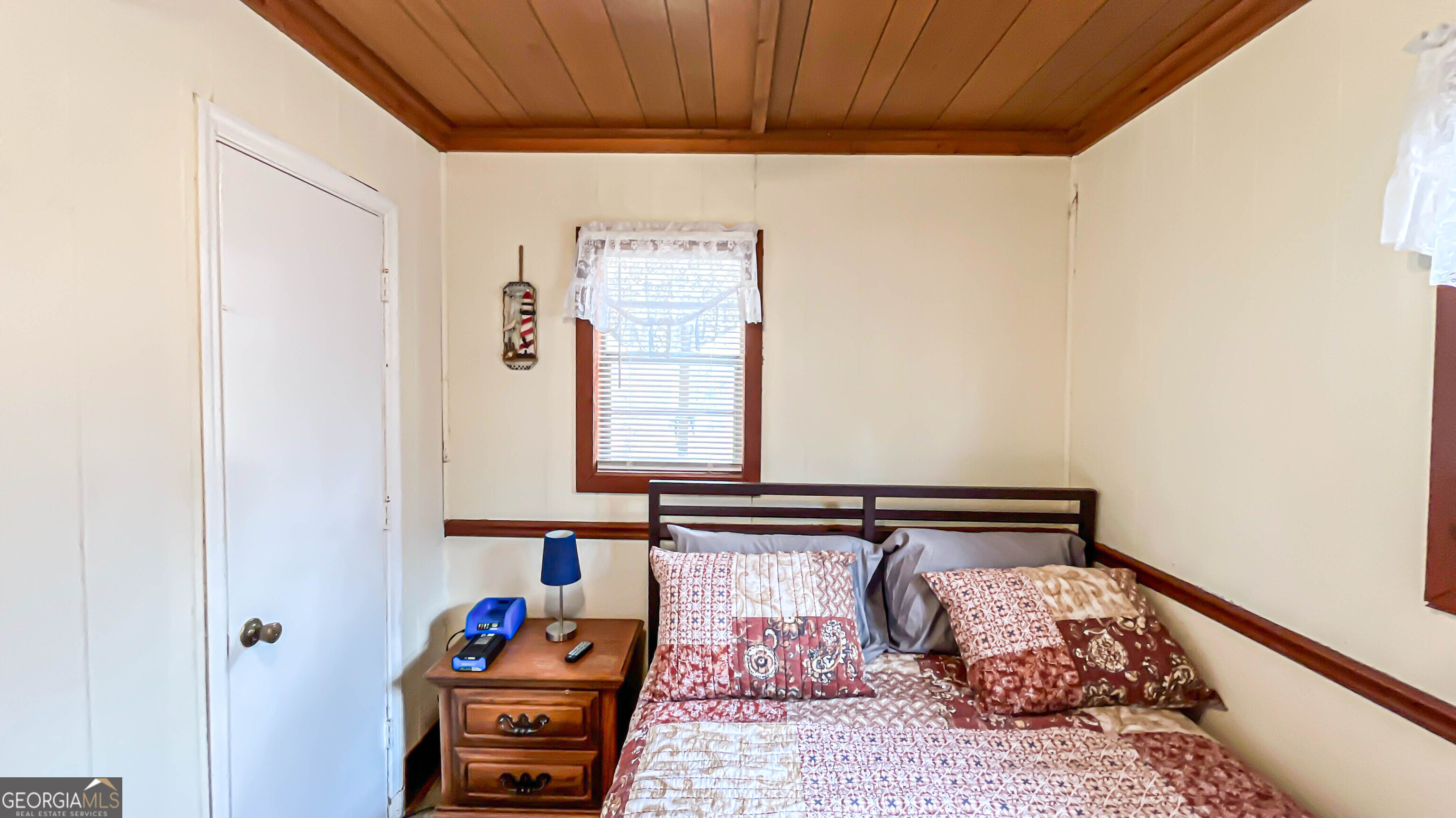 242 Katy Lake Road Jackson, GA 30233 - Photo 31 of 113 a bedroom with a bed and a window