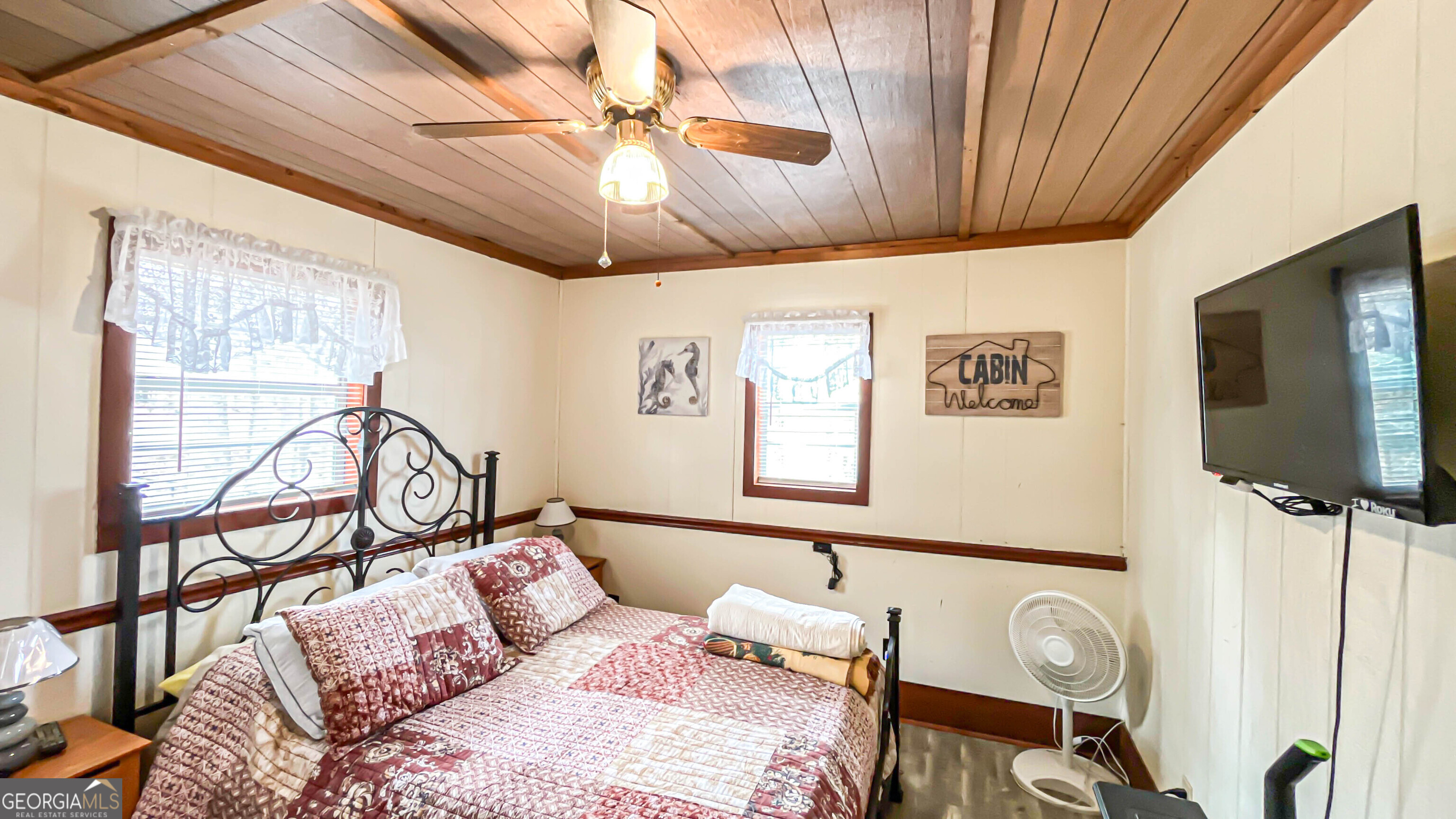 242 Katy Lake Road Jackson, GA 30233 - Photo 39 of 113 a bedroom with furniture and a flat screen tv