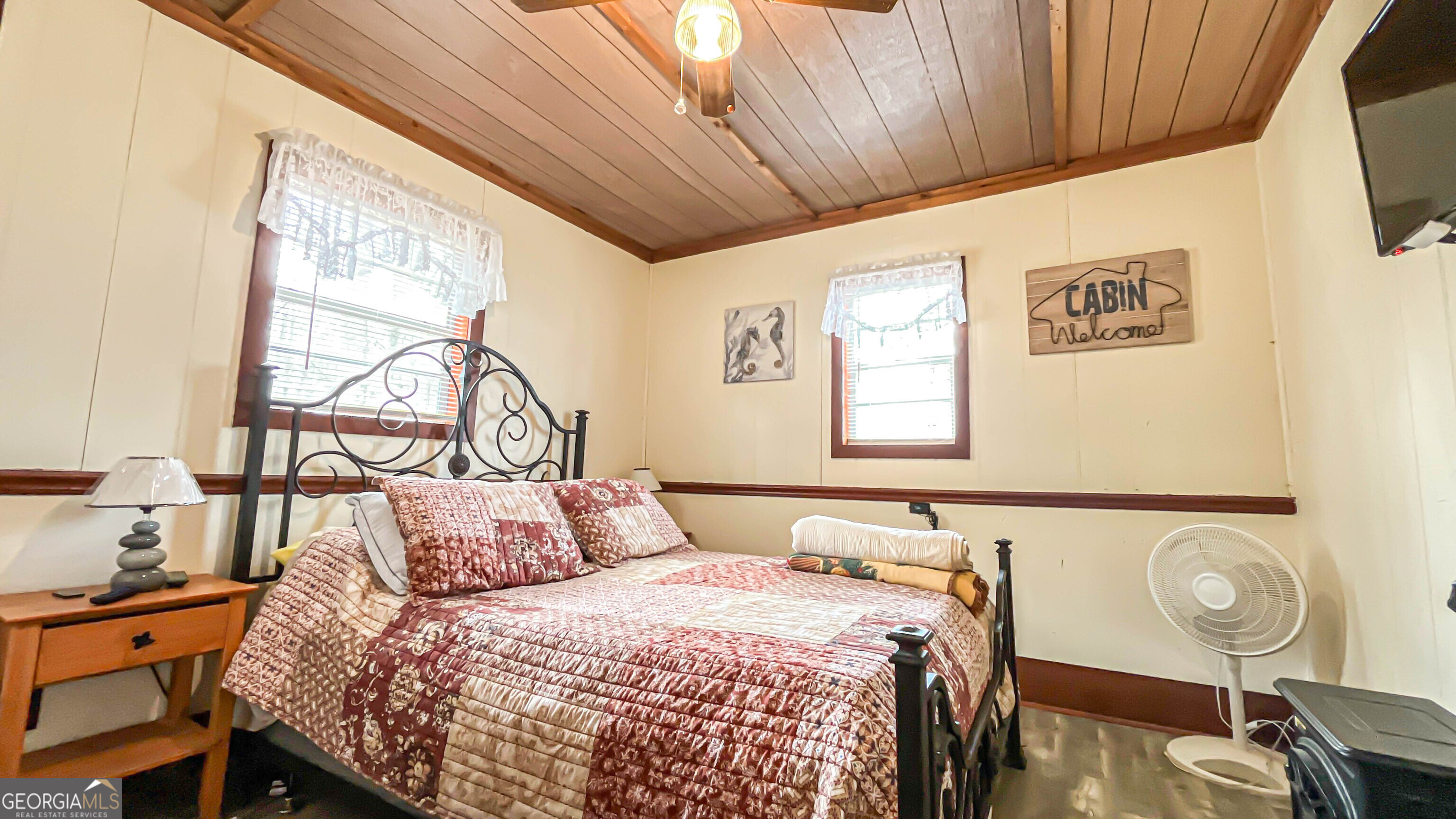 242 Katy Lake Road Jackson, GA 30233 - Photo 41 of 113 a bedroom with a bed and wooden floor