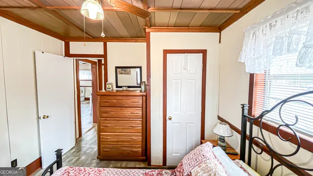 a swimming pool with trees in the background