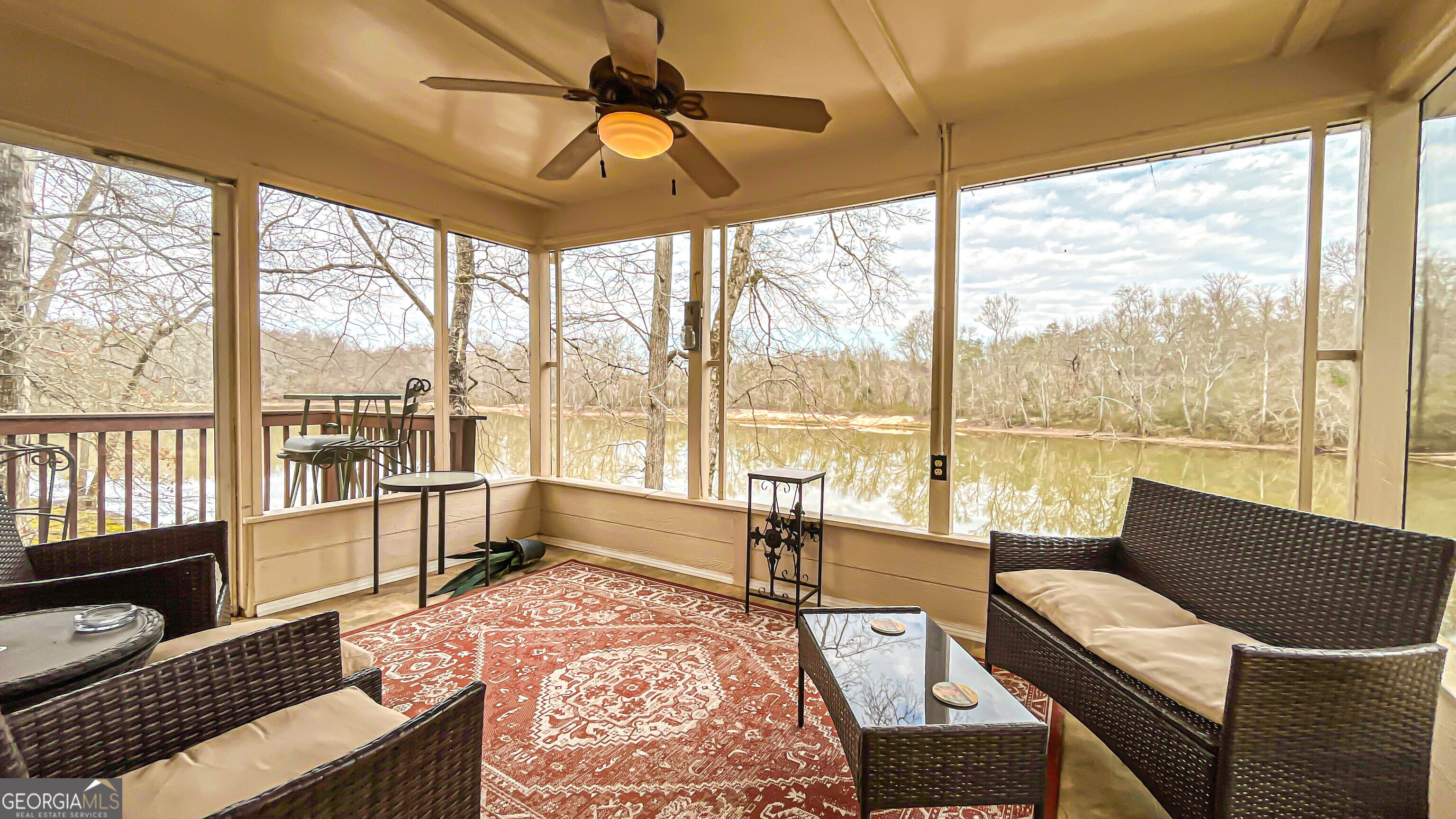 242 Katy Lake Road Jackson, GA 30233 - Photo 43 of 113 a living room with furniture and floor to ceiling windows