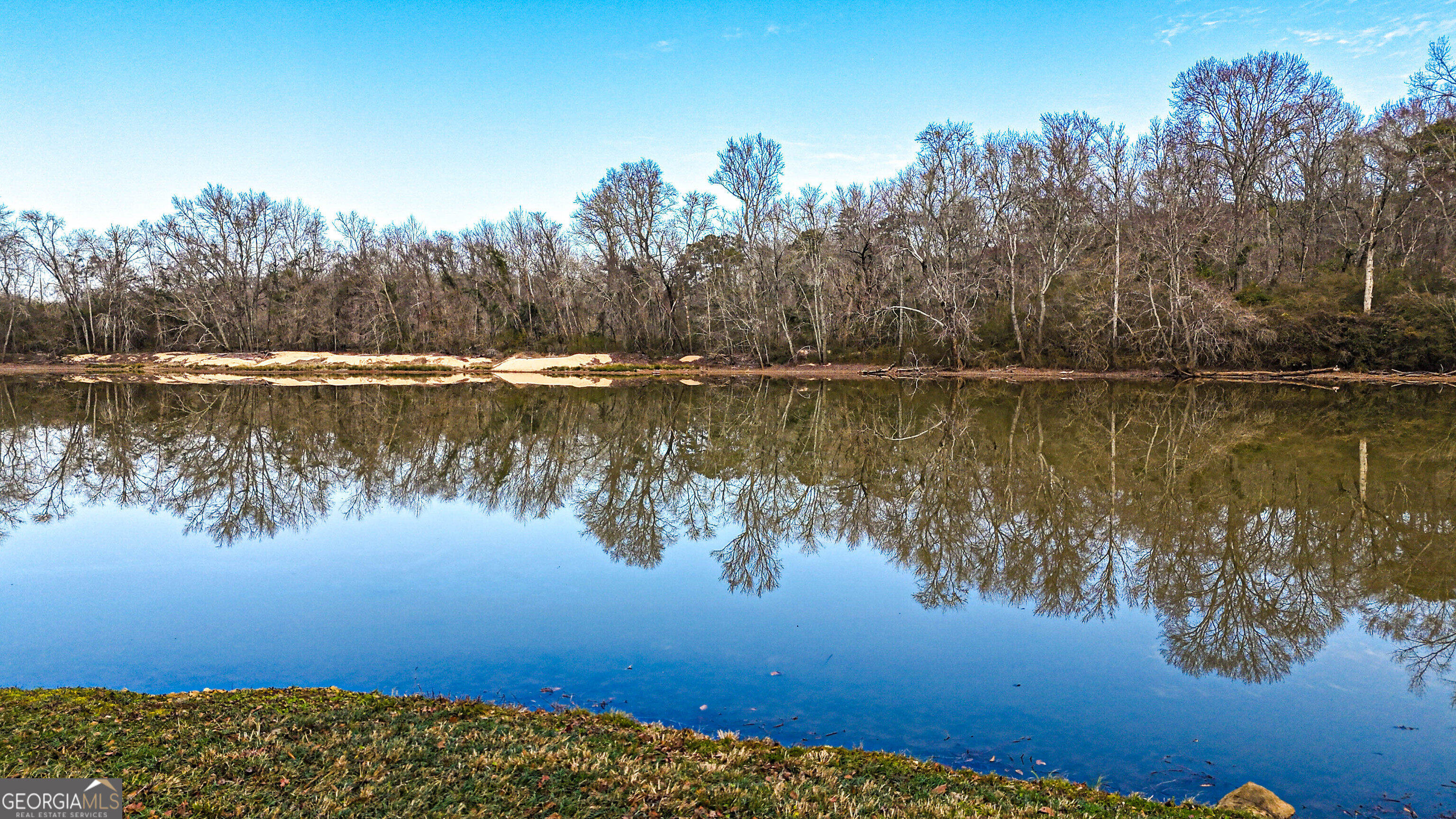 242 Katy Lake Road Jackson, GA 30233 - Photo 55 of 113 a view of a lake with a mountain in the background