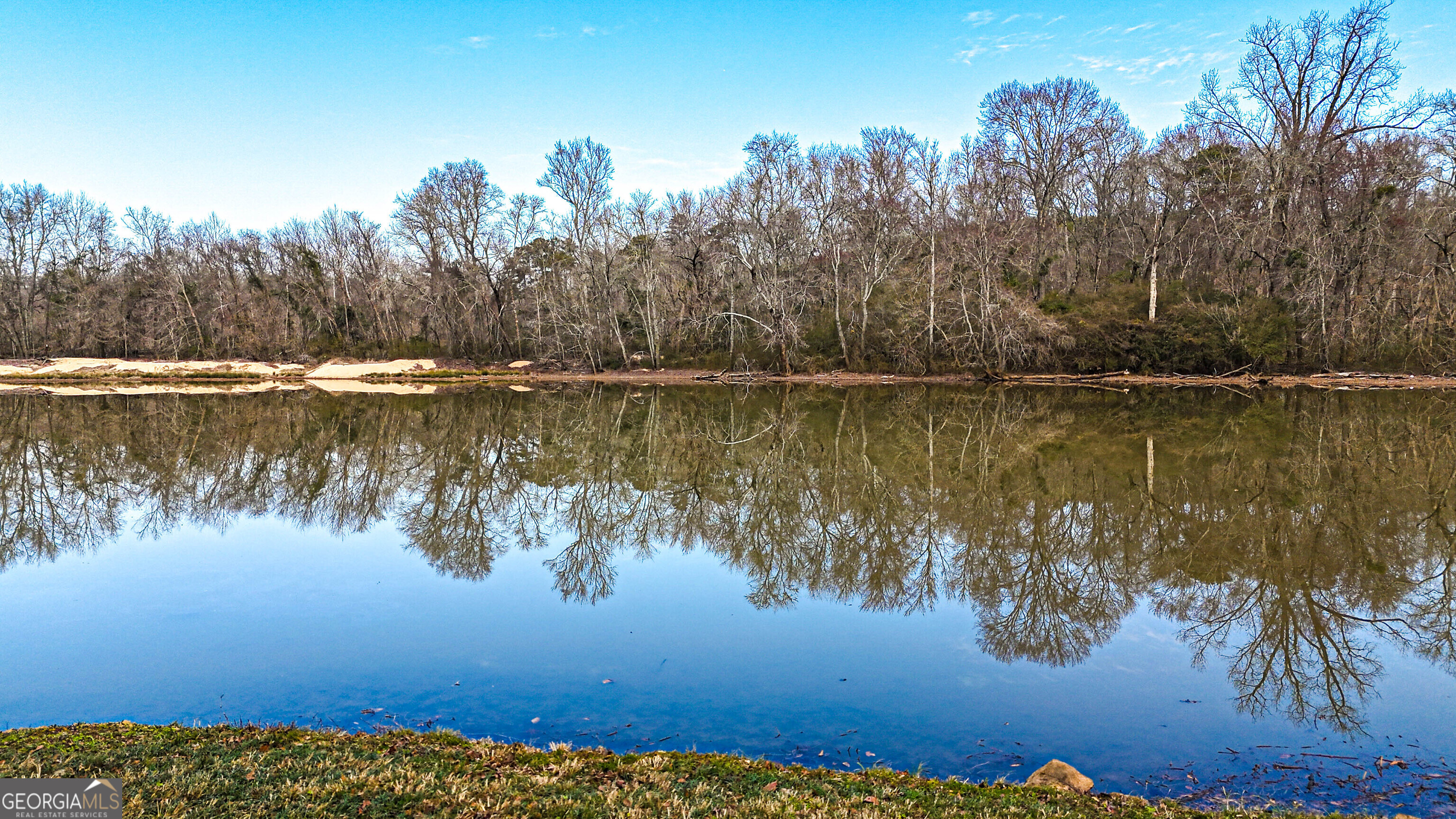 242 Katy Lake Road Jackson, GA 30233 - Photo 60 of 113 a view of a lake with houses in the background